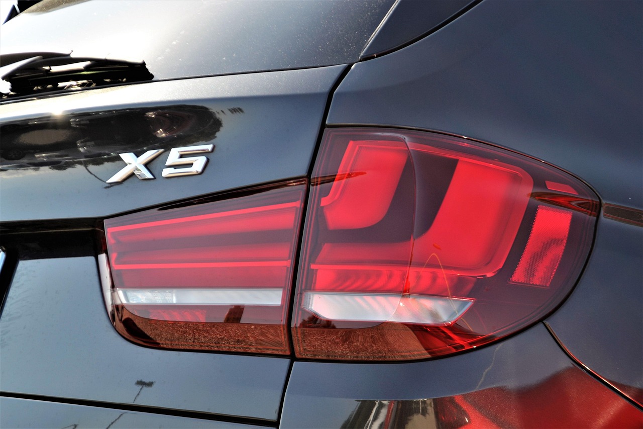 pre-owned, bmw x5, suv, taillight, break-light, hatchback, red, reflective, hazard light, door, closed, logo, symbol, chrome, black, shinny, auto, automobile, automotive, dealership, parked, transport, car, transportation, vehicle, dealer, industry, parking, owned, brand, model, caution, stop, off, glare, sunny, shiny, luxury, design, back, corner, smooth, seamless, aluminum, metal, fiber, glass, tinted window, shine, stainless, metallic, car wallpapers, strong, silver, bright, lines, light